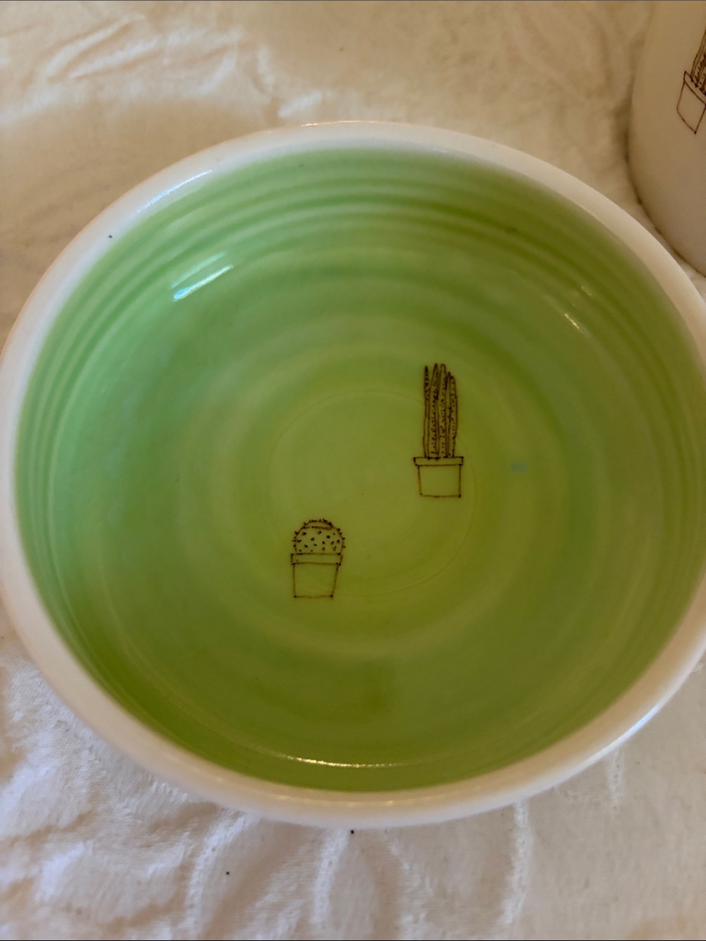 Whimsical White Ceramic Planter with Green Interior and Cactus Motif - Picture 3 of 11